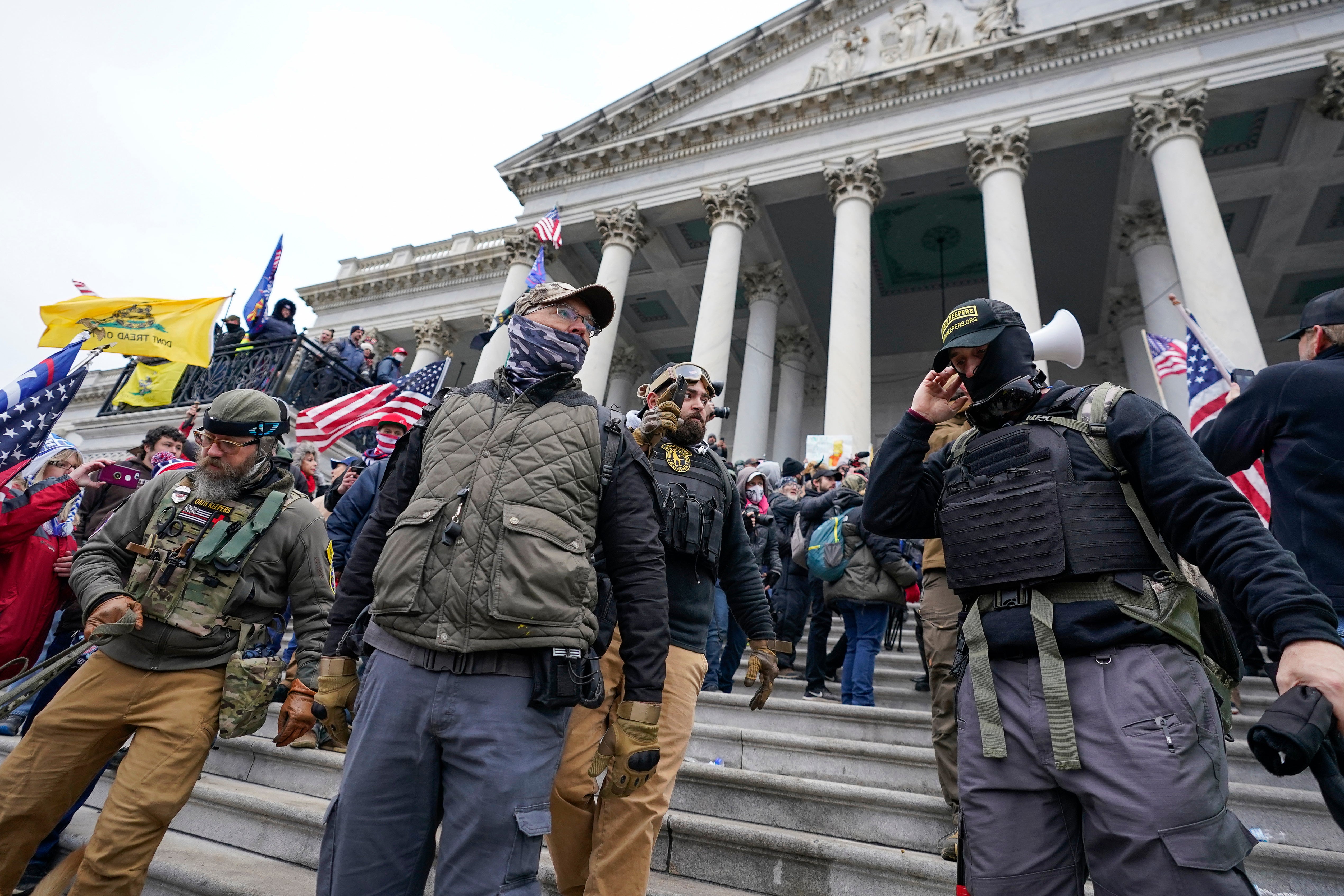 File. Members of the Oath Keepers extremist group stand on the East Front of the US Capitol on 6 January 2021 in Washington