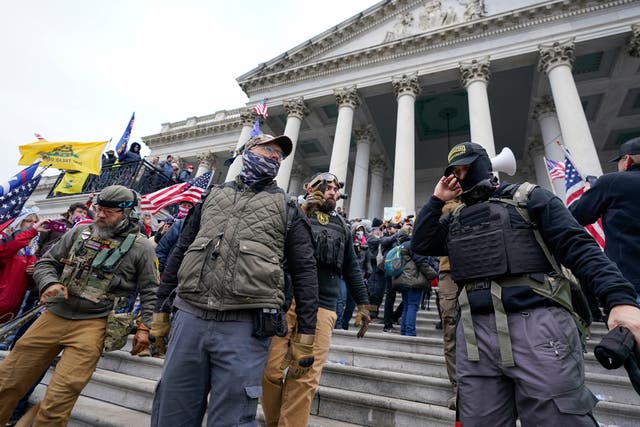 <p>File. Members of the Oath Keepers extremist group stand on the East Front of the US Capitol on 6 January 2021 in Washington</p>