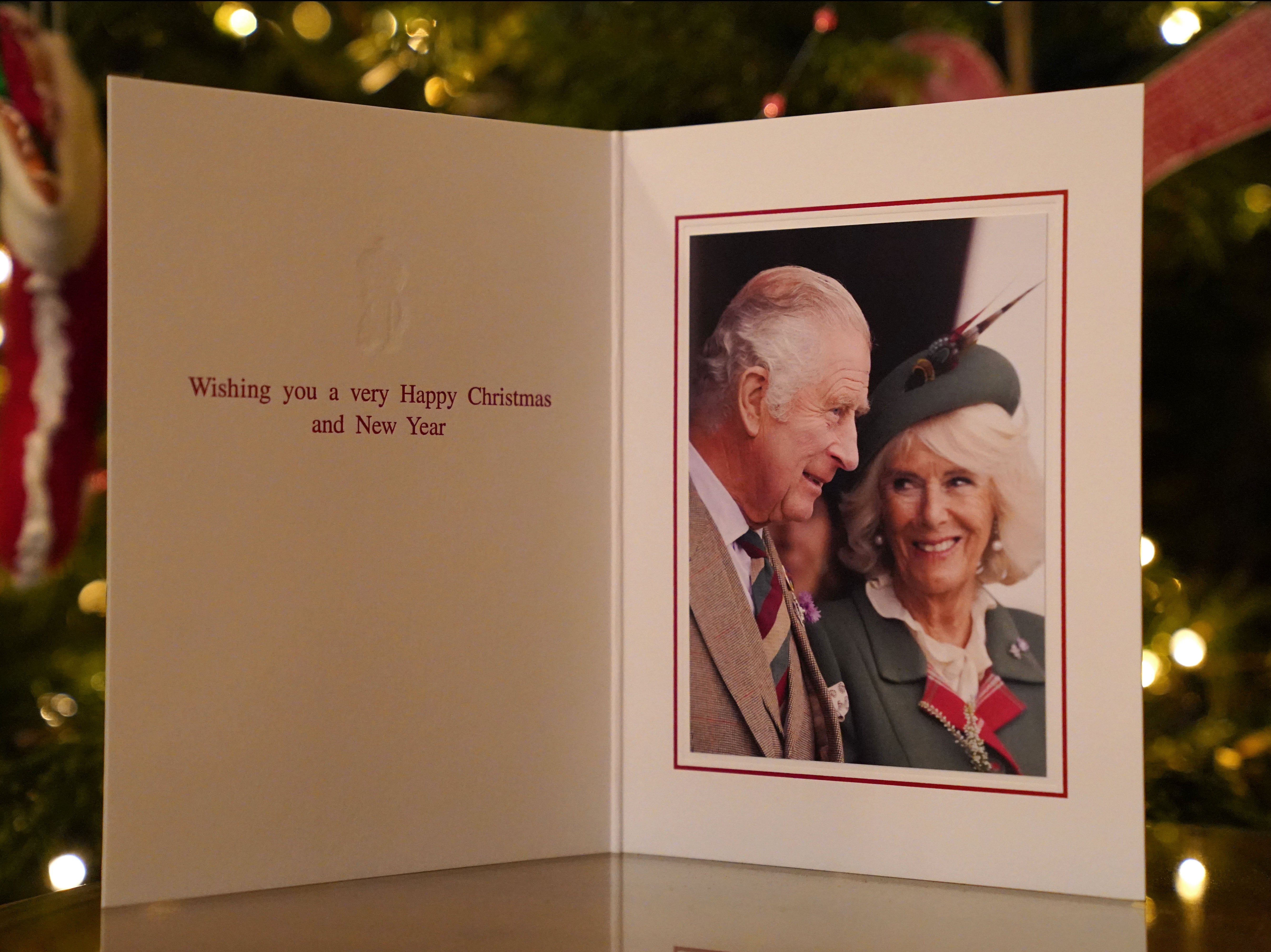 The 2022 Christmas card of King Charles III and Camilla, Queen Consort in front of a Christmas tree in Clarence House, on December 11, 2022