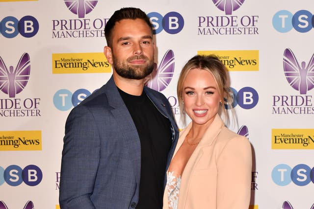 <p>Jorgie Porter (R) and Ollie Piotrowski (L) attend the MEN Pride of Manchester Awards 2022 at Kimpton Clocktower Hotel on May 10, 2022</p>