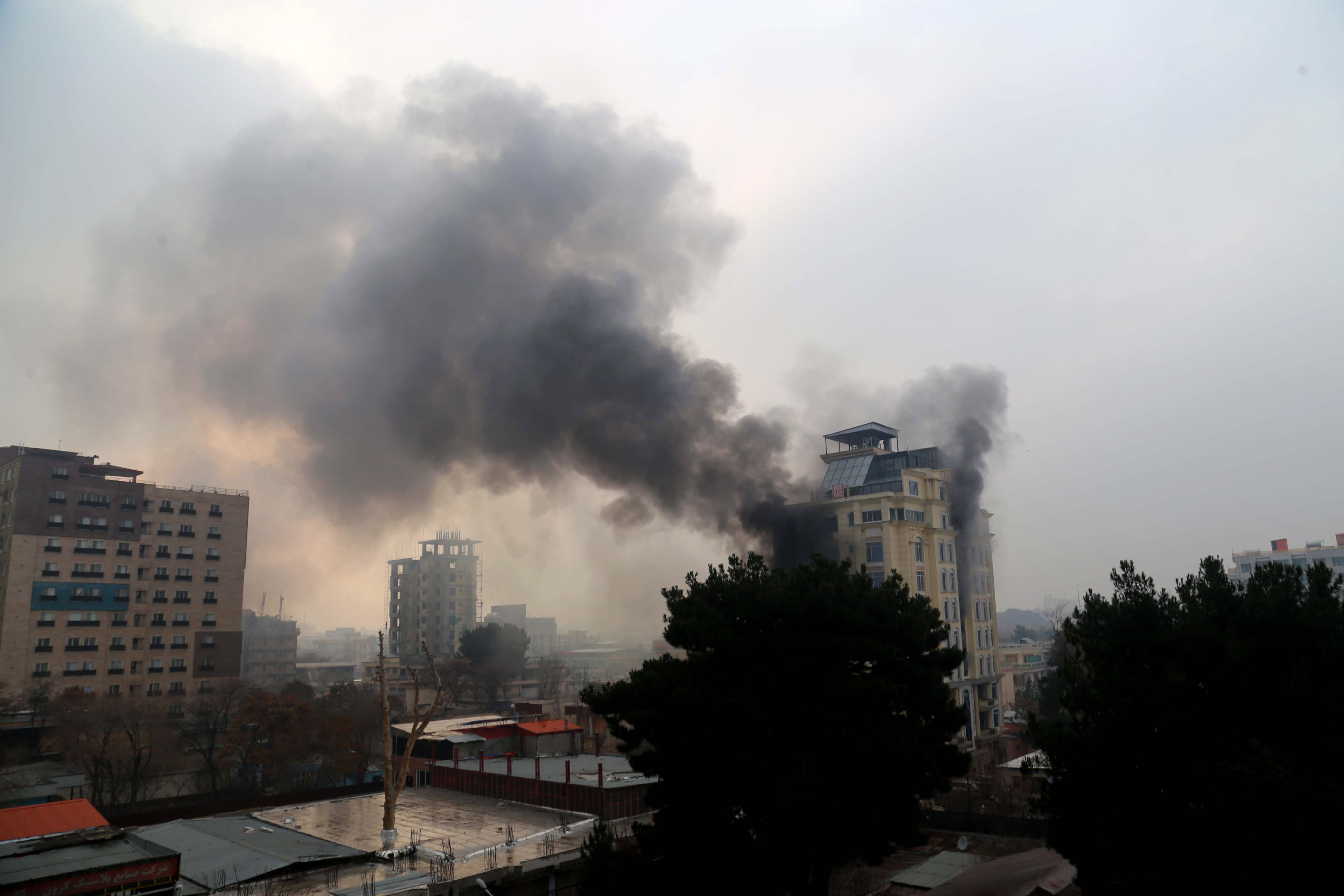 Smoke billows from a hotel after an attack in Kabul, Afghanistan on 12 December