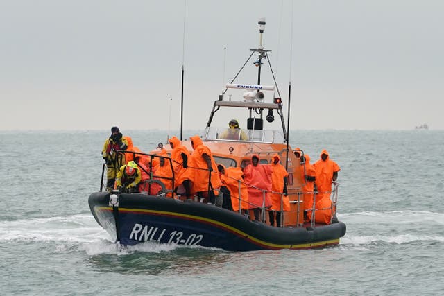 A group of people thought to be migrants are brought in to Dungeness, Kent, after being rescued by the RNLI following a small boat incident in the Channel. Picture date: Friday December 9, 2022 (Gareth Fuller/PA)