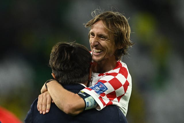 <p>Croatia's Luka Modric celebrates with coach Zlatko Dalic</p>