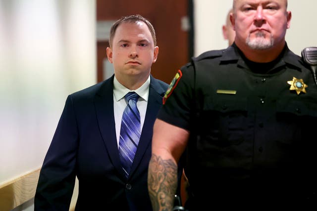 <p>Aaron Dean arrives at the 396th District Court in Fort Worth on 5 December 2022, in Fort Worth, Texas, for the first day of his trial in the murder of Atatiana Jefferson</p>