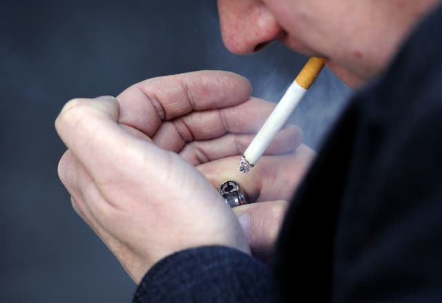 <p>File: Image of a man smoking a cigarette</p>