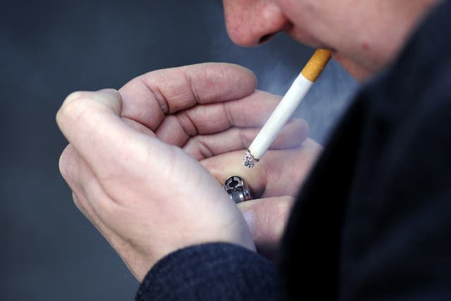 <p>File: Image of a man smoking a cigarette</p>