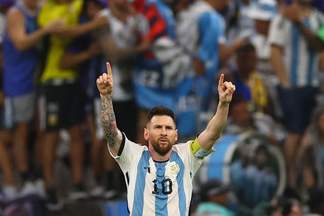 <p>Lionel Messi points to the sky after scoring against Netherlands</p>