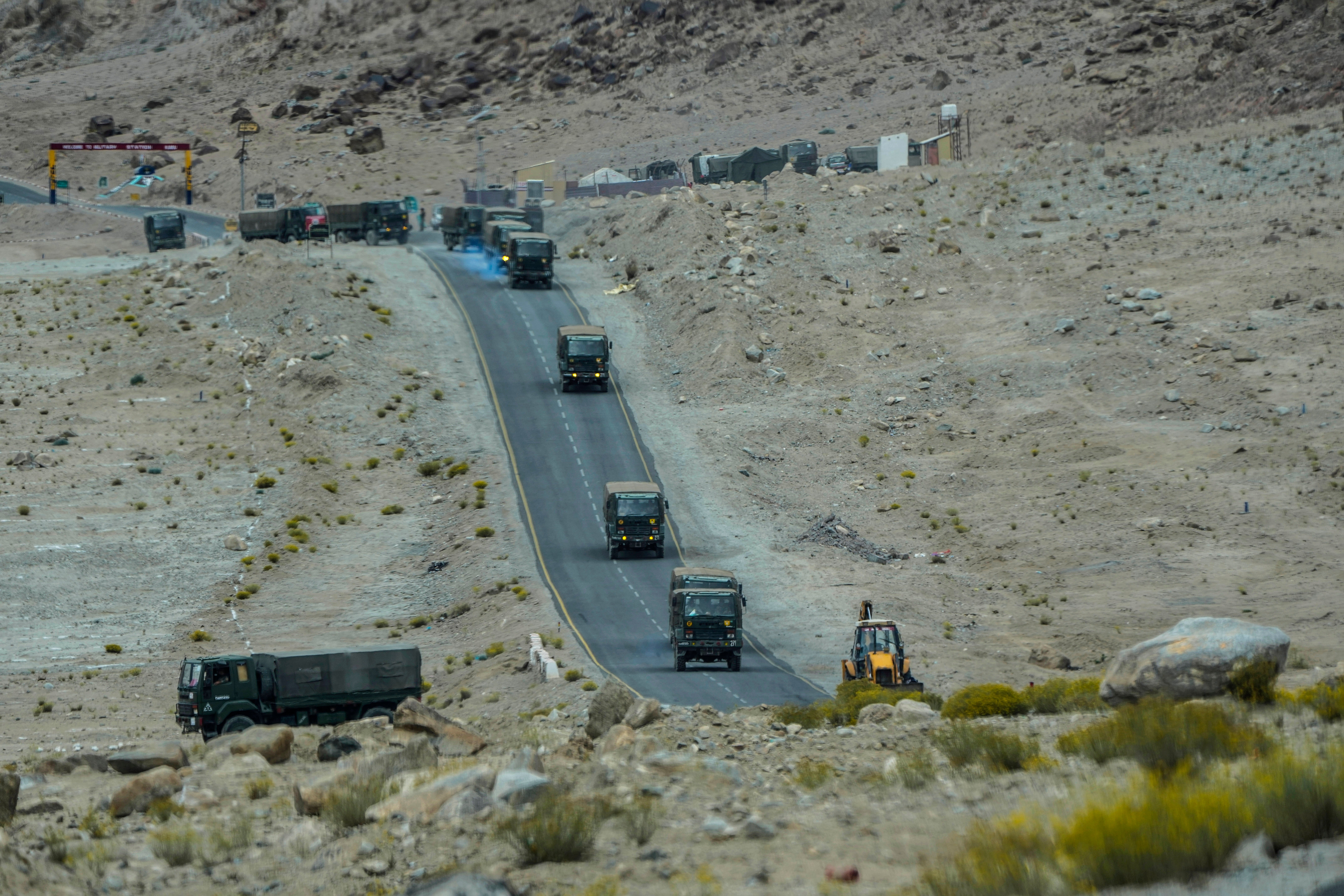 Indian army vehicles move in a convoy in the cold desert region of Ladakh, India in September