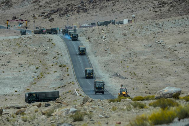 <p>Indian army vehicles move in a convoy in the cold desert region of Ladakh, India on Tuesday </p>