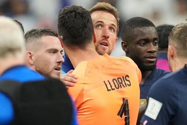 Harry Kane is consoled by Tottenham team-mate Hugo Lloris (Martin Rickett/PA)