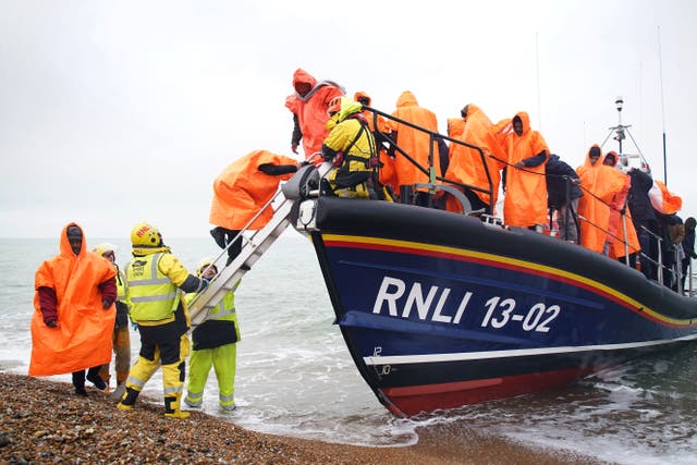 <p>A group of people thought to be migrants are brought in to Dungeness, Kent (Gareth Fuller/PA)</p>