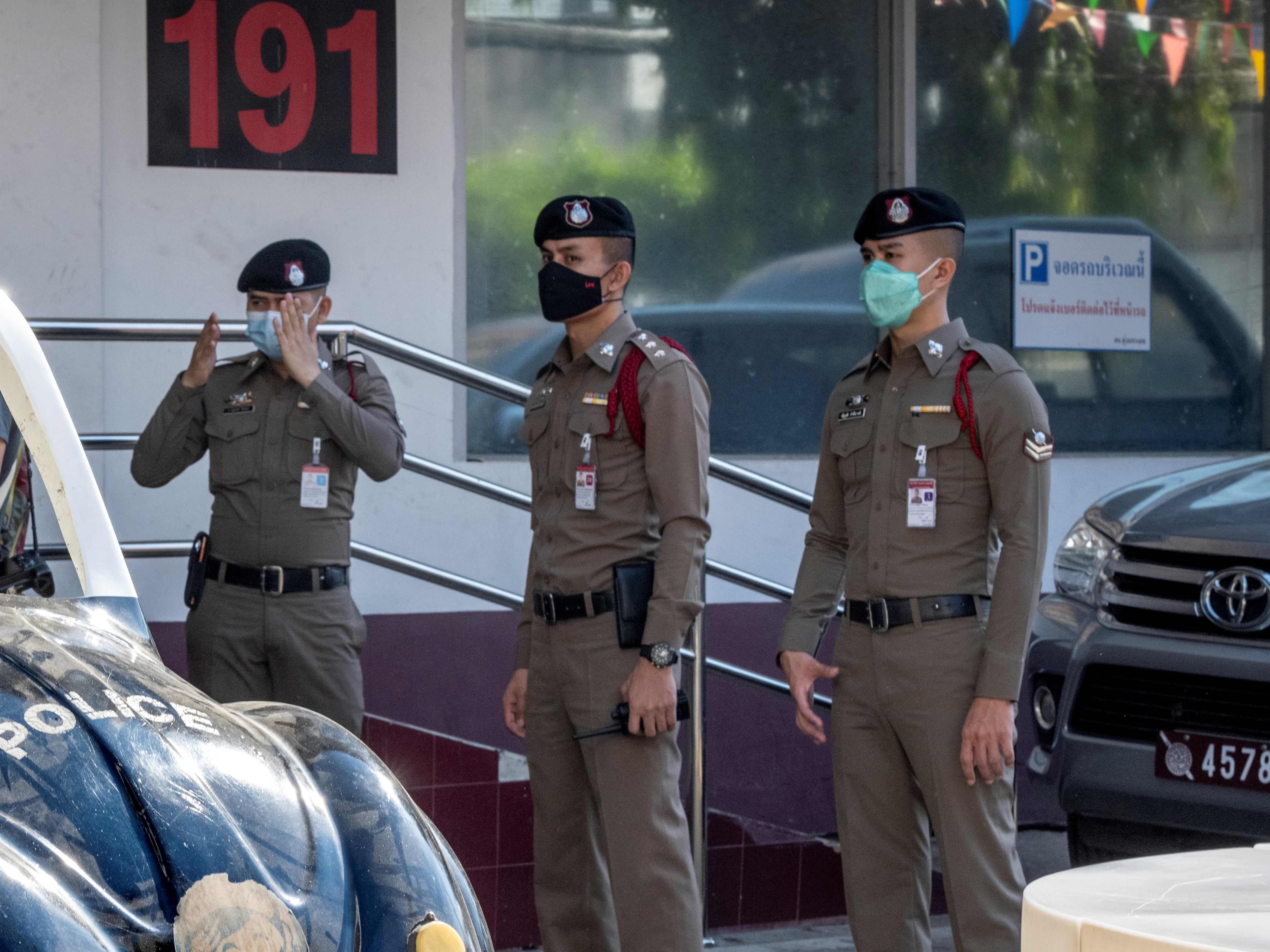 Representational image: Thai policemen stand guard at the entrance of a police station in Bangkok