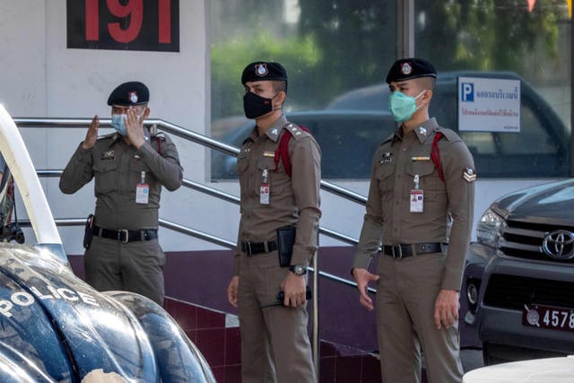 <p>Representational image: Thai policemen stand guard at the entrance of a police station in Bangkok </p>