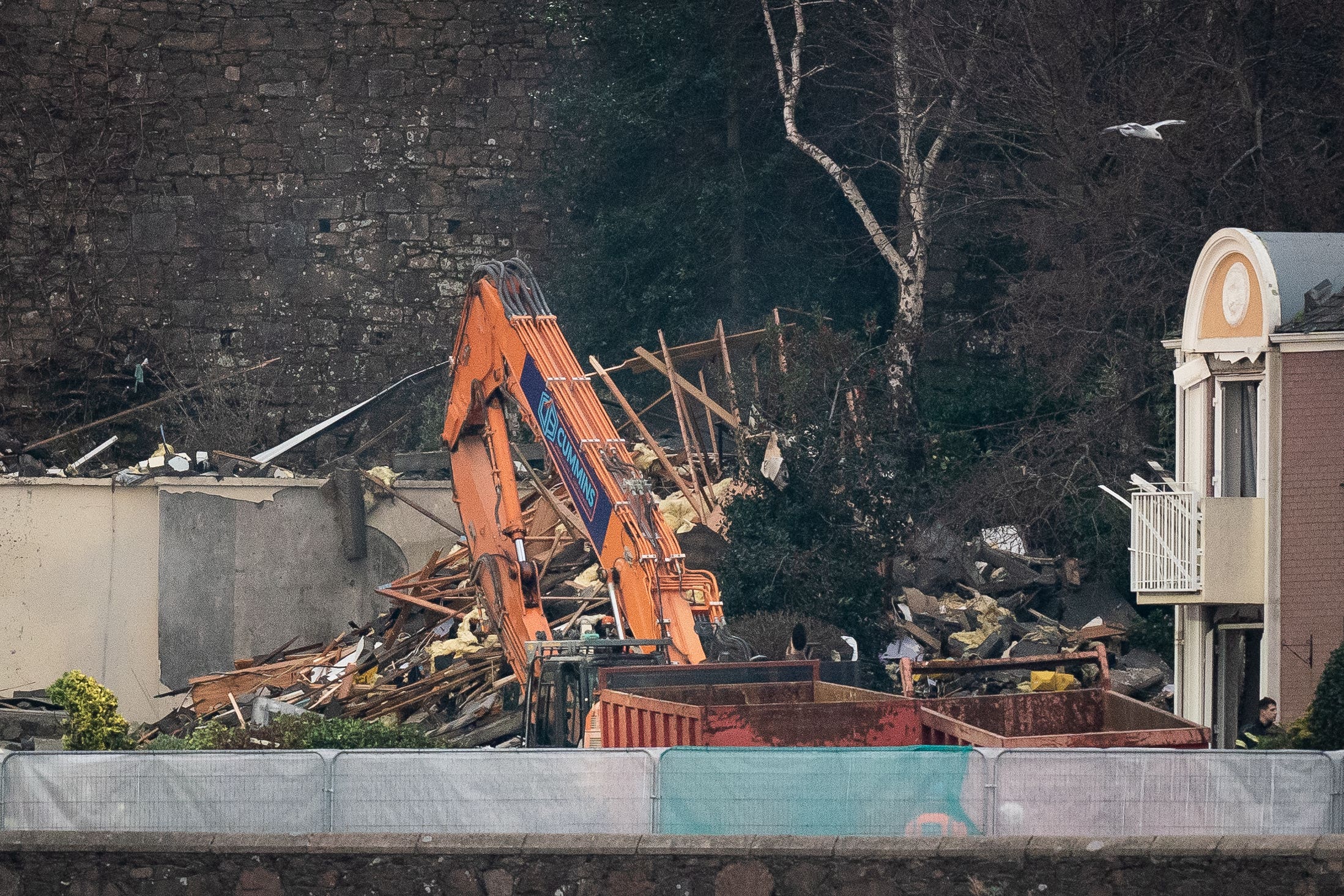 Rubble being cleared after the explosion and fire at a block of flats in St Helier, Jersey (Aaron Chown/PA)