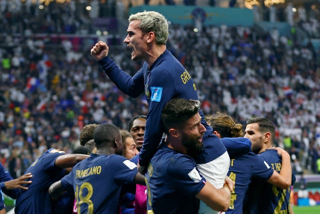 <p>Griezmann celebrates after assisting Olivier Giroud in the quarter-final against England </p>