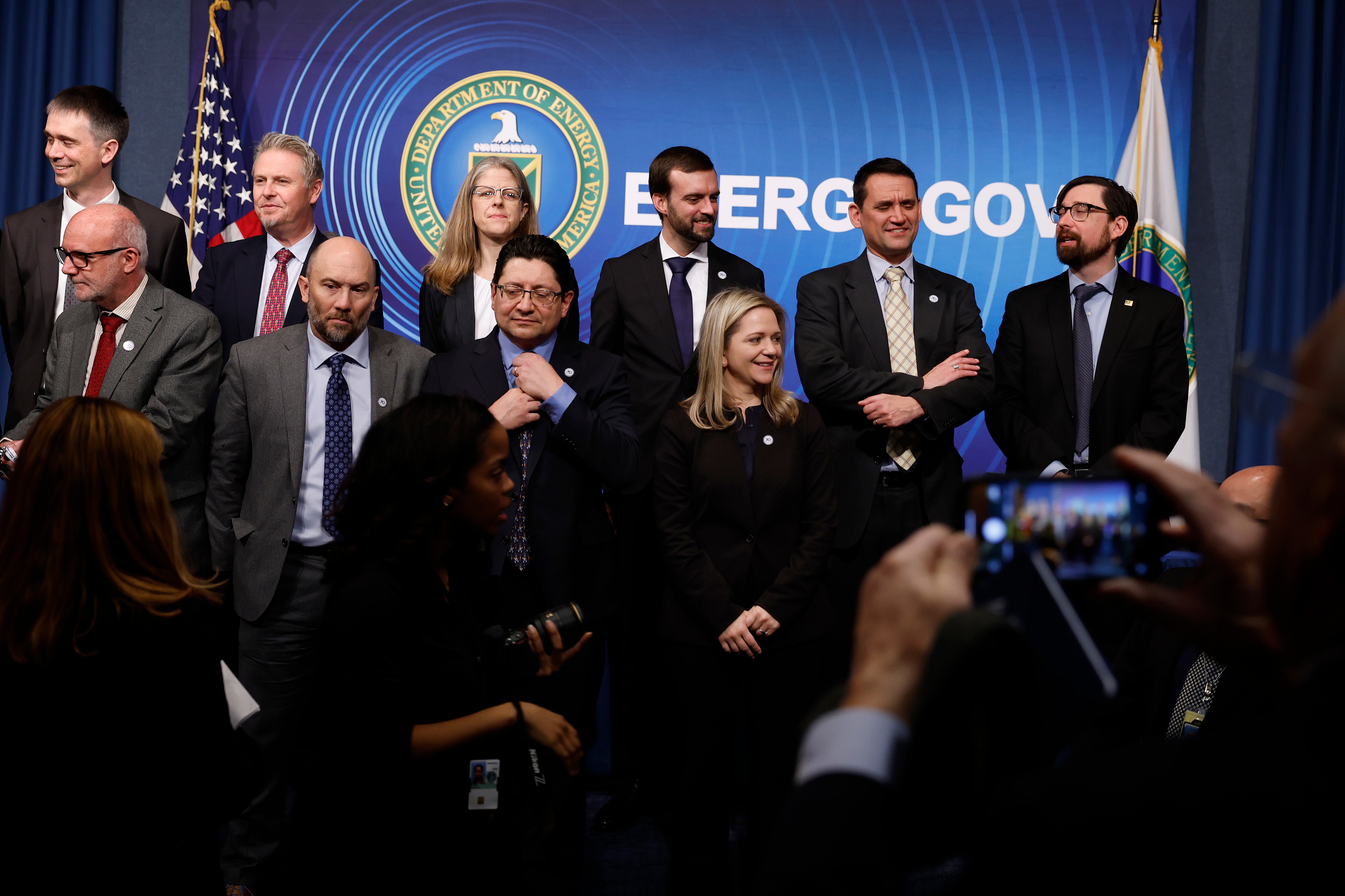 Scientists, engineers and administrators from the Lawrence Livermore National Laboratories prepare for a group photograph at the Department of Energy