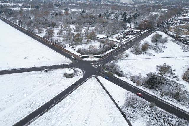 Snow and ice warnings continue for Britons on Wednesday after thousands were left without power in freezing conditions (Yui Mok/PA)