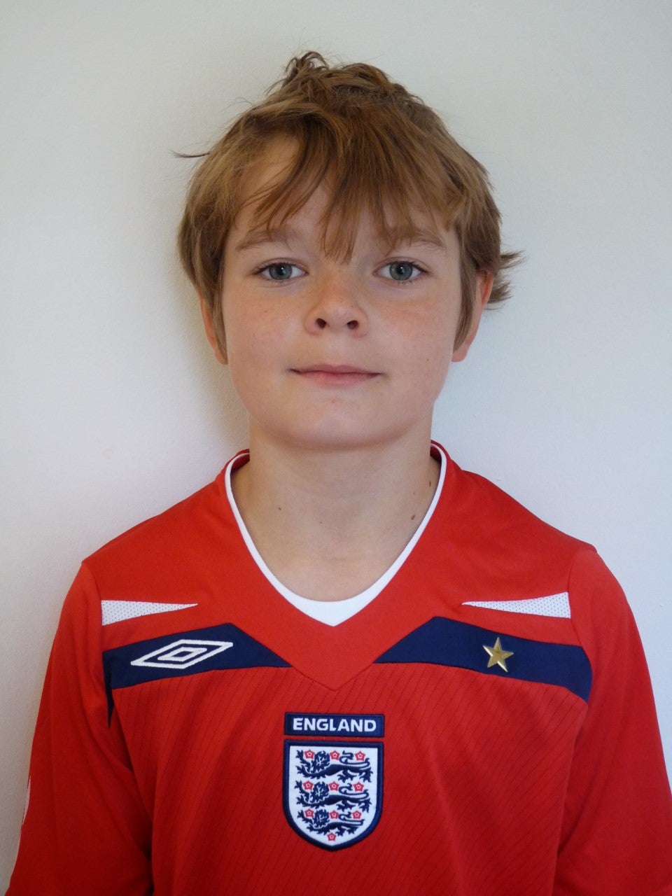 Christian poses as a child in his England top; his mother is from Canterbury and, after his funeral at Brabourne Church of England, he was buried with his grandmother