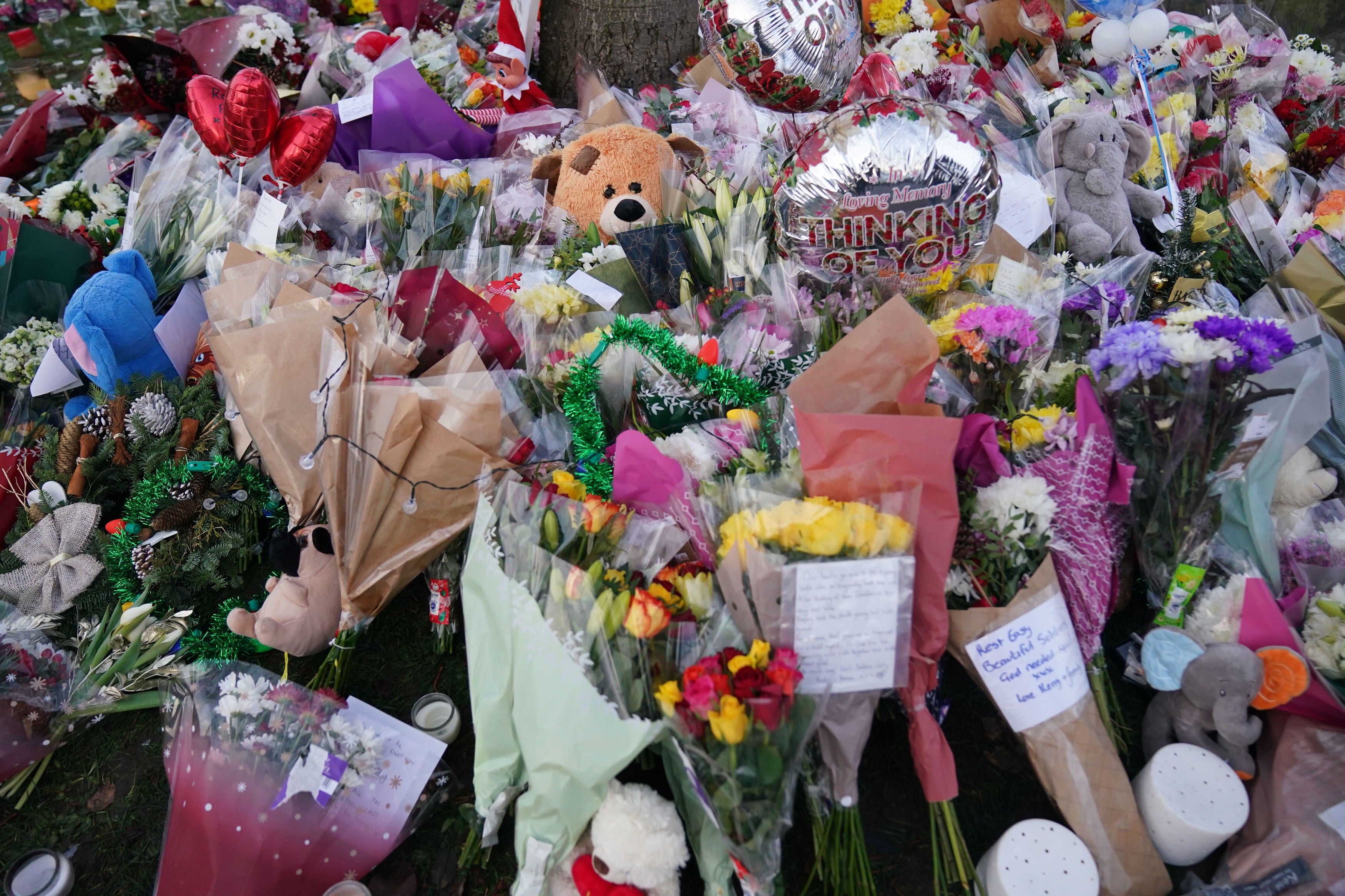Flowers and tributes near to Babbs Mill Park in Kingshurst, Solihull, after the deaths of three boys aged eight, 10 and 11 who fell through ice into a lake in the West Midlands