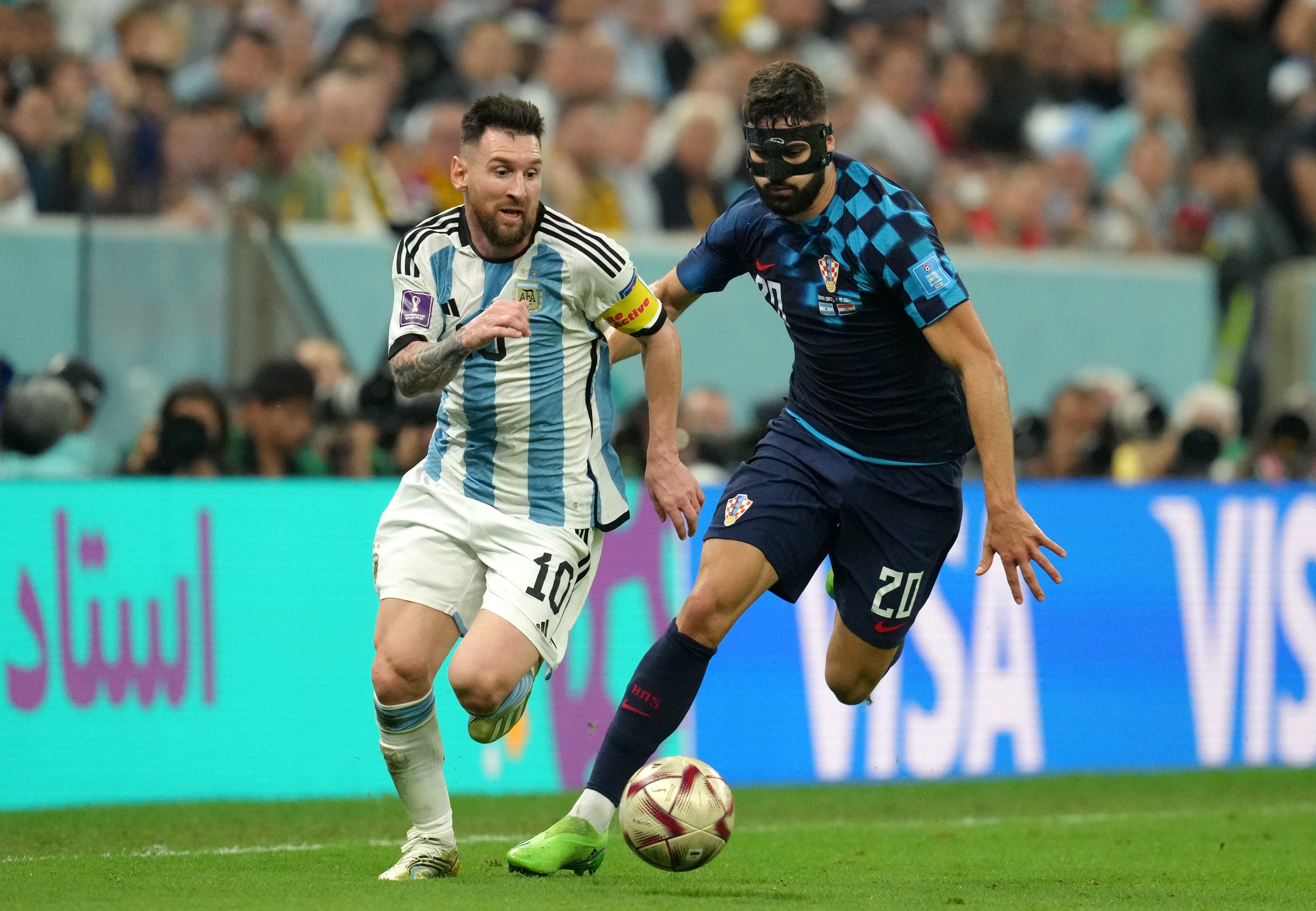 Lionel Messi dribbles away from Croatian defender Josko Gvardiol