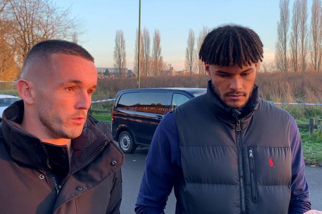 Aston Villa’s John McGinn and Tyrone Mings during their visit close to the scene of the tragedy in Babbs Mill Park in Kingshurst, Solihull (Richard Vernalls/PA)