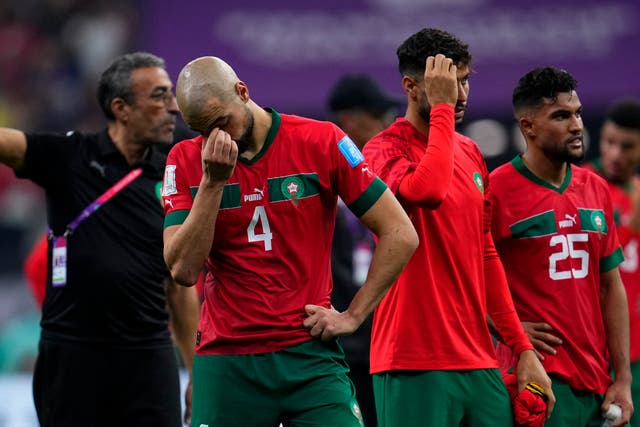 <p>Morocco’s Sofyan Amrabat looks down after being defeated by France</p>