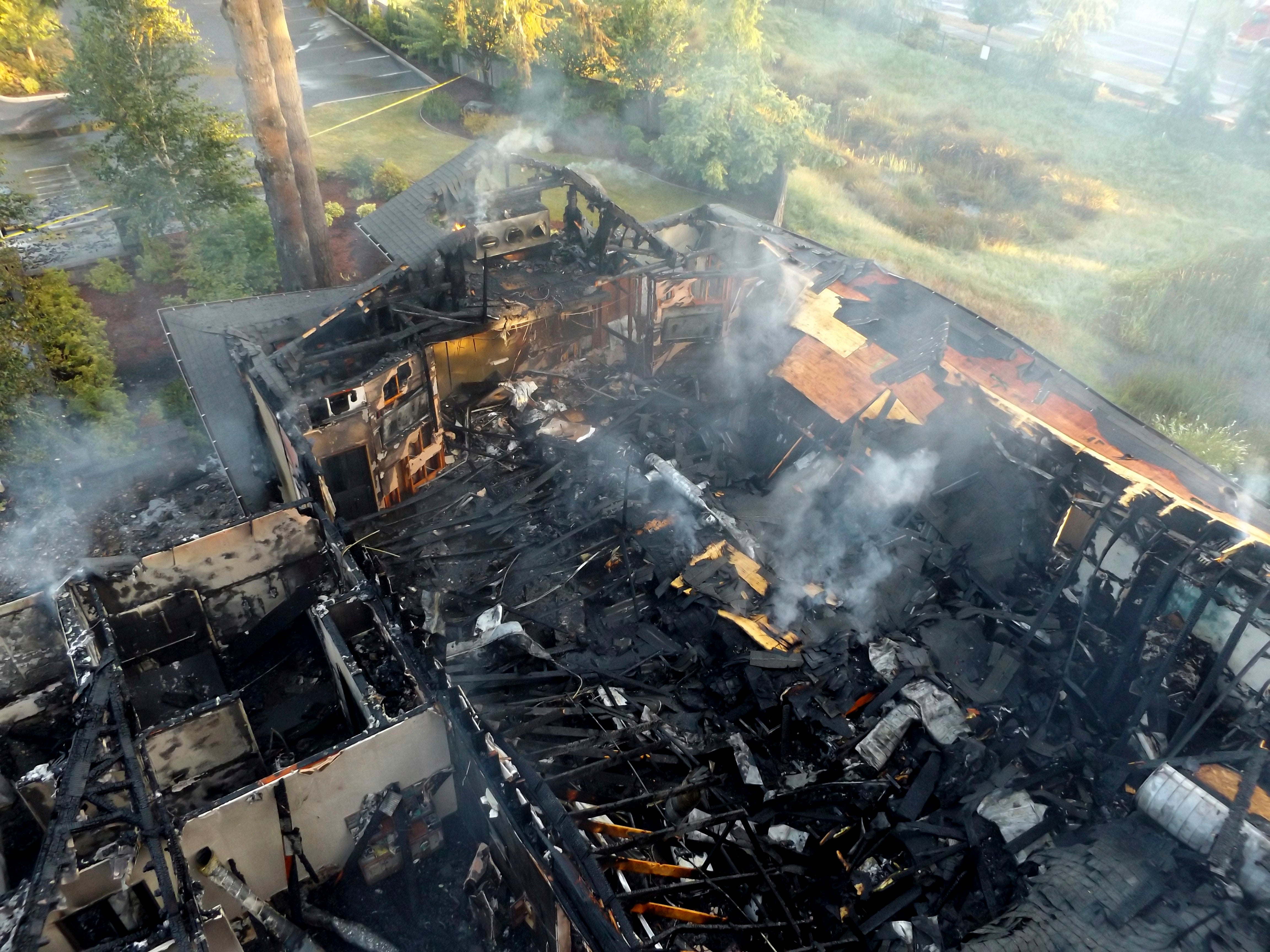 This photo provided by Olympia Fire Department shows damage from an arson that destroyed the Jehovah’s Witness kingdom hall in Olympia, Washington, on 3 July 2018