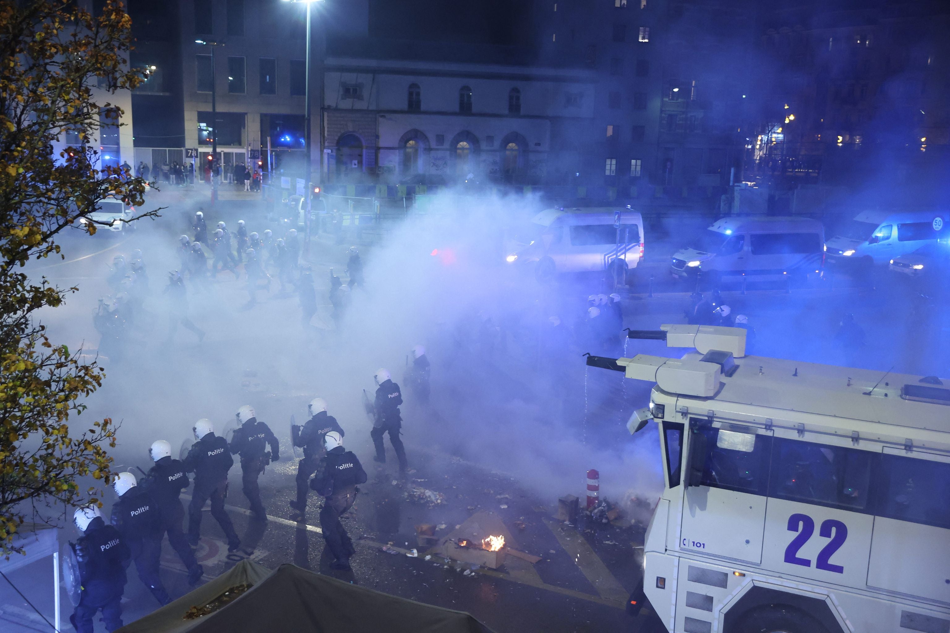 Riot police during clashes in Brussels after the semi-final
