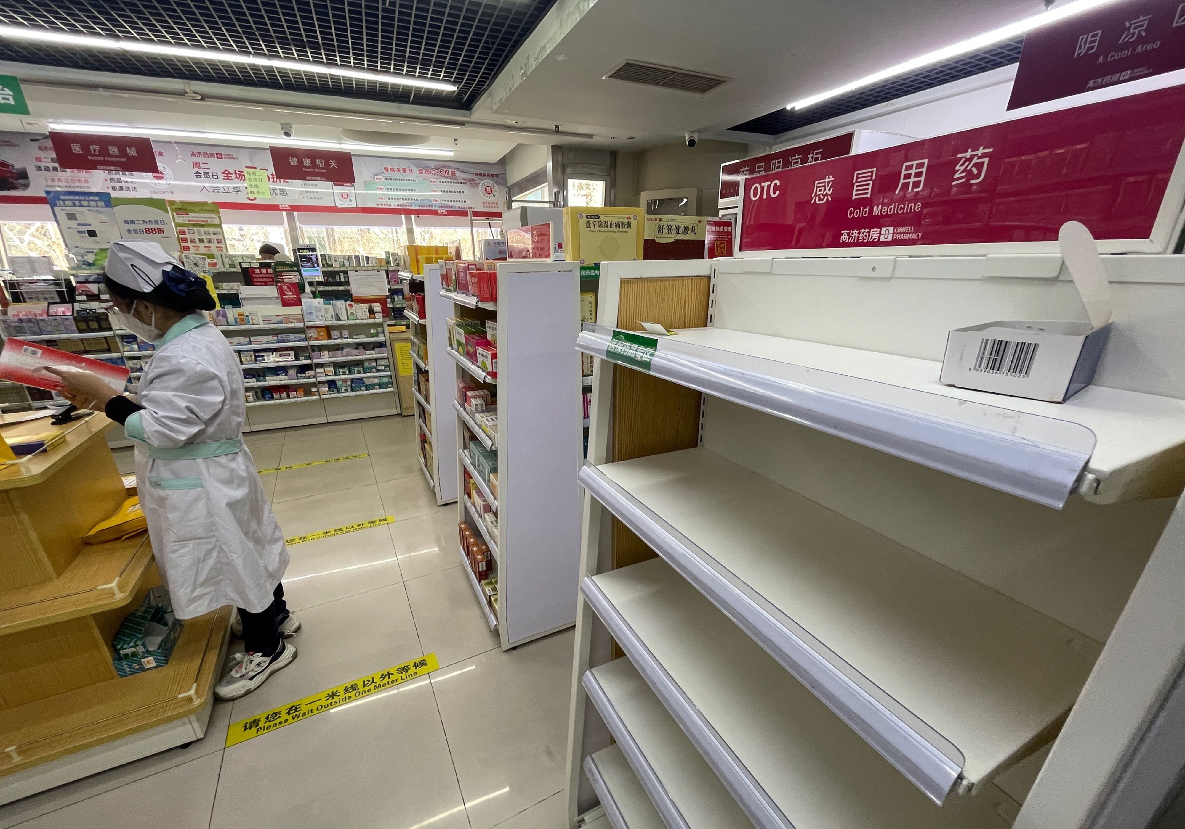 <p>Empty shelf of cold medicine at a pharmacy in Beijing</p>