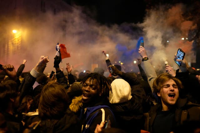 <p>Supporters of France next to the Arc de Triomphe after the World Cup semi-final between France and Morocco</p>