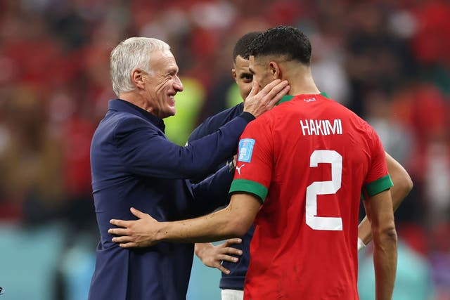 <p>French head coach Didier Deschamps embraces Achraf Hakimi of Morocco after the match </p>