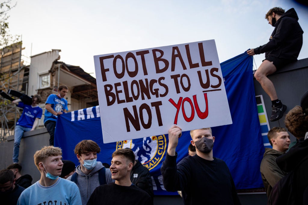 Football fans protest against the Super League following the attempted breakaway last year