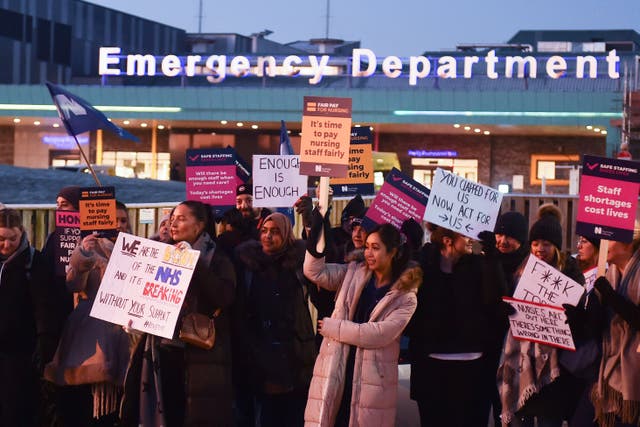 Nurses on picket lines have said staff shortages mean patients are being neglected, while low salaries mean some nurses are turning to food banks to feed their children (Peter Powell/PA)