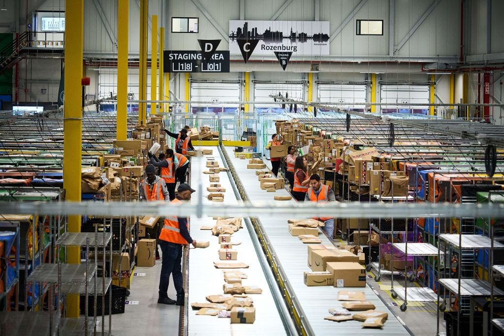 Employees work at an Amazon delivery station in Rozenburg, Netherlands
