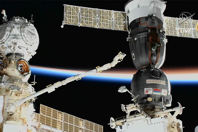 <p>The European robotic arm controlled by cosmonaut Anna Kikina surveys the Soyuz MS-22 crew ship after the detection of a leak that cancelled Wednesday’s spacewalk</p>