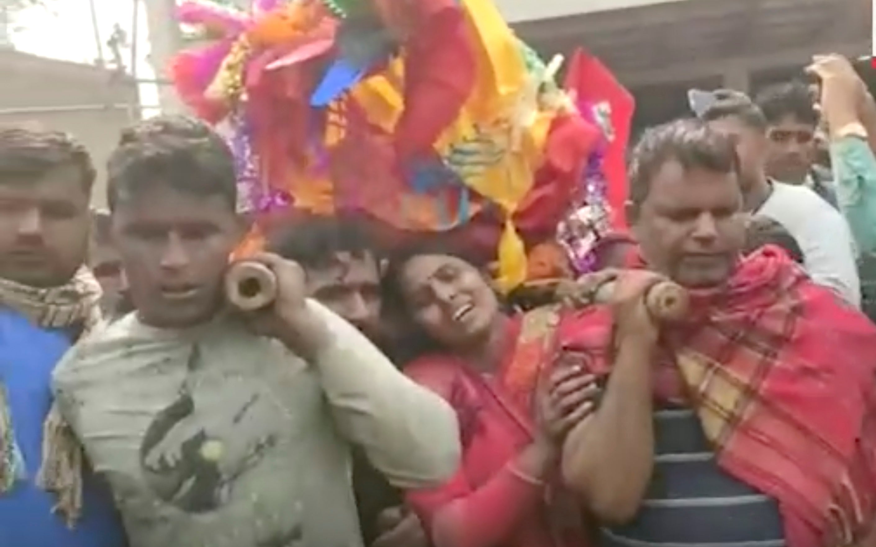This image from a video shows relatives preparing to cremate the body of a victim suspected to have died after drinking tainted liquor in Saran district of Bihar state, India, Thursday, 15 December 2022