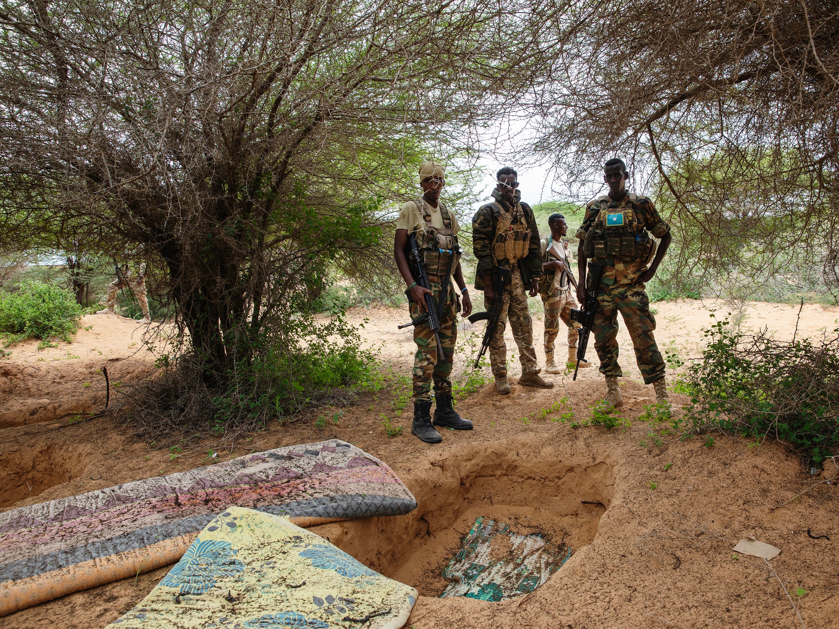 Danab and Gorgor soldiers stand near a former al-Shabab camp in Masjid Ali Guduud, an area recently taken back from al-Shabab control in Somalia