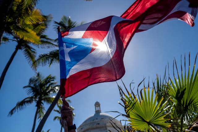 <p>The Puerto Rican flag flies in San Juan</p>