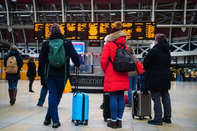 Train passengers planning Christmas Eve trips are being told to complete journeys as early as lunchtime due to strikes (PA)