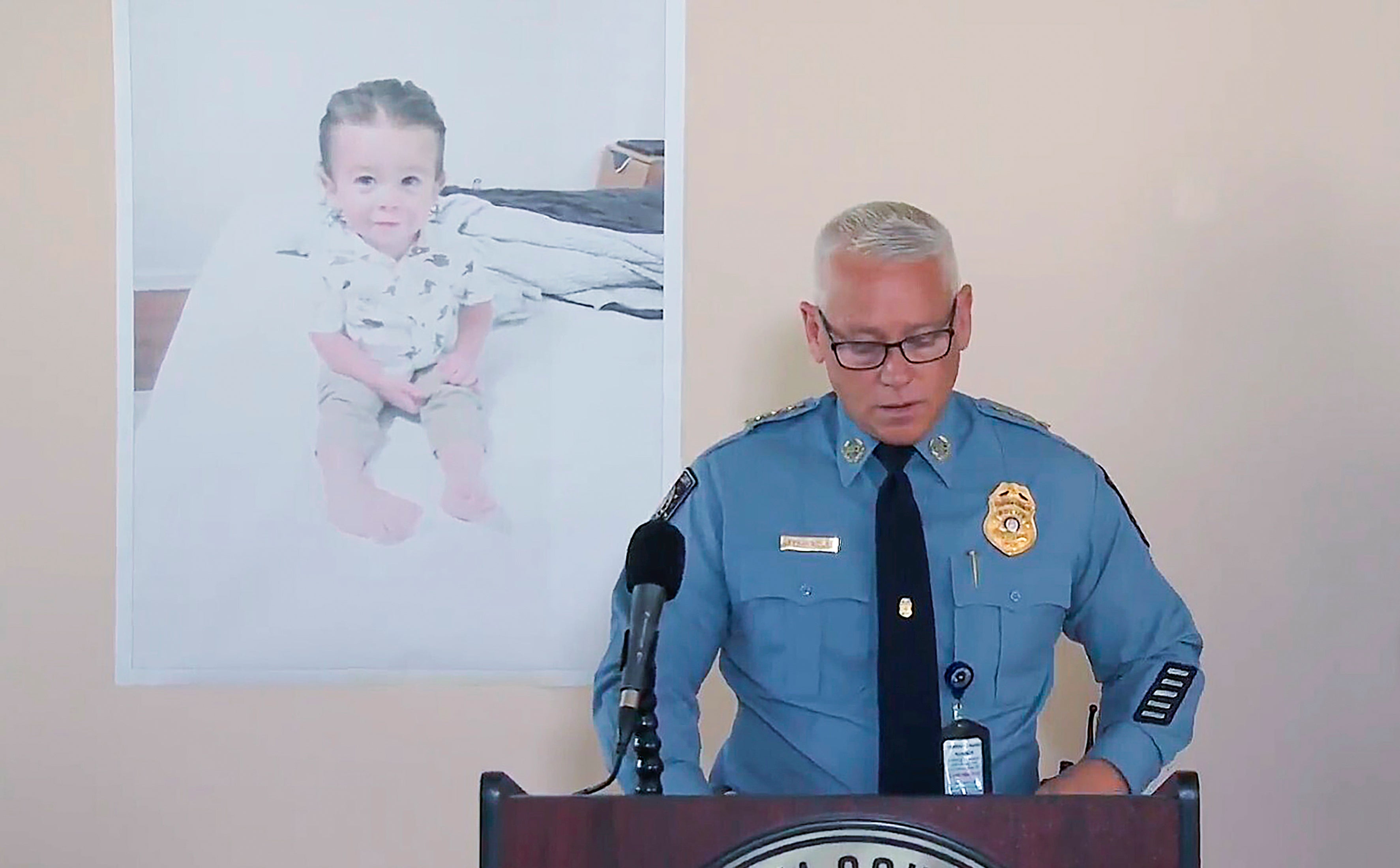 Police Chief Jeff Hadley speaks to reporters as he stands in front of a large photo of toddler Quinton Simon before the boy’s remains were found at a Georgia landfill