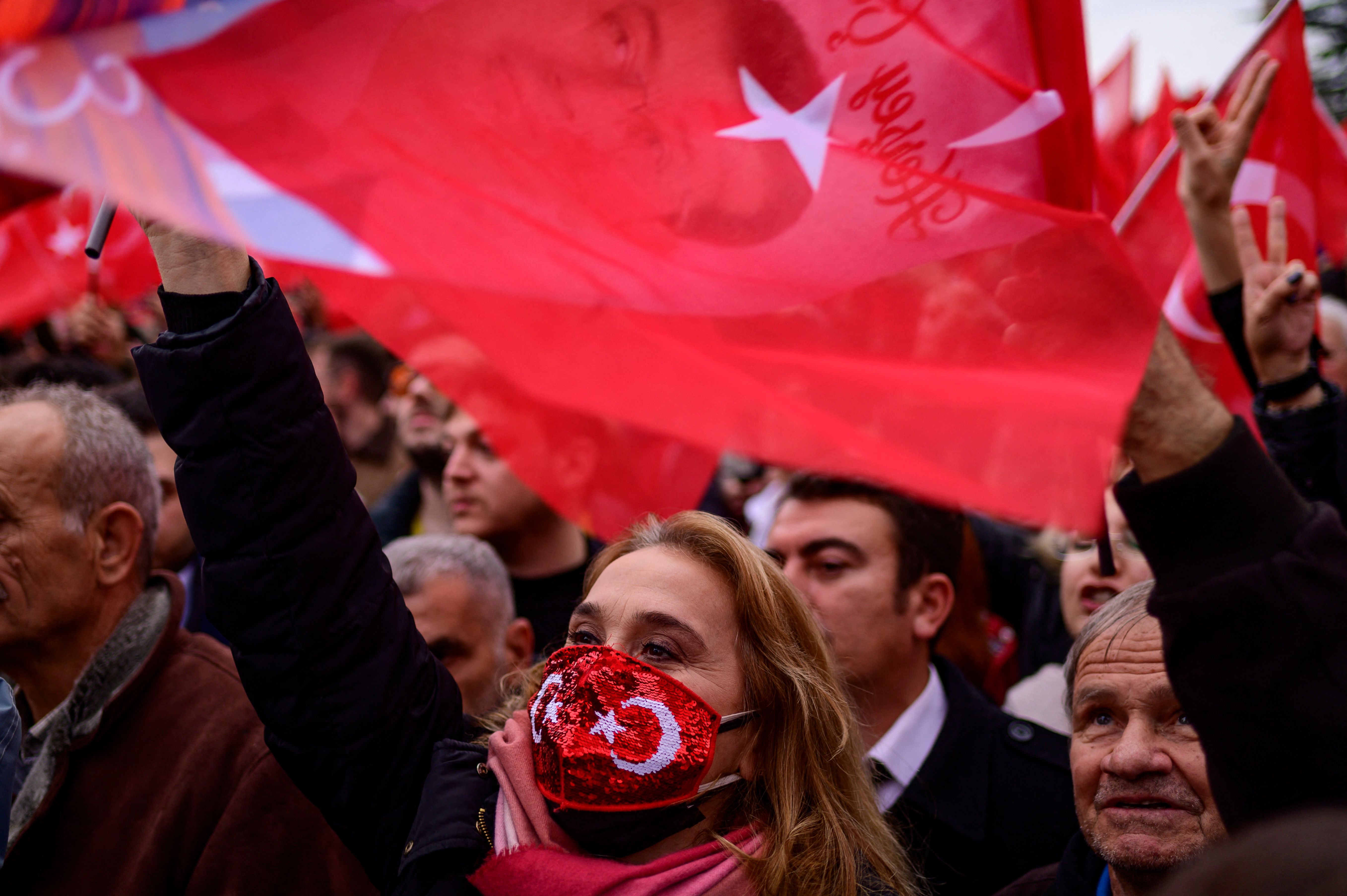 Supporters of Istanbul mayor Ekrem Imamoglu wave national flags on Thursday