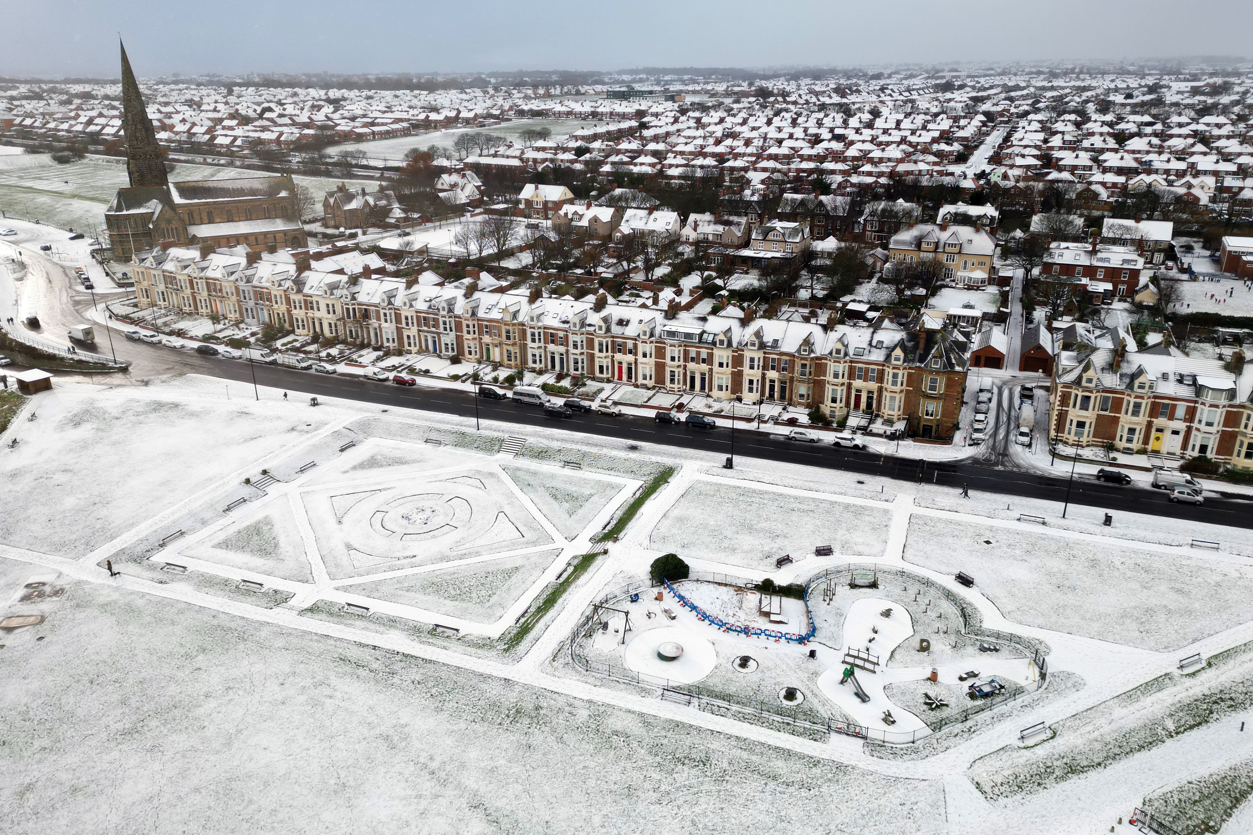 Fresh snow at Cullercoats on the north-east coast of England (PA)