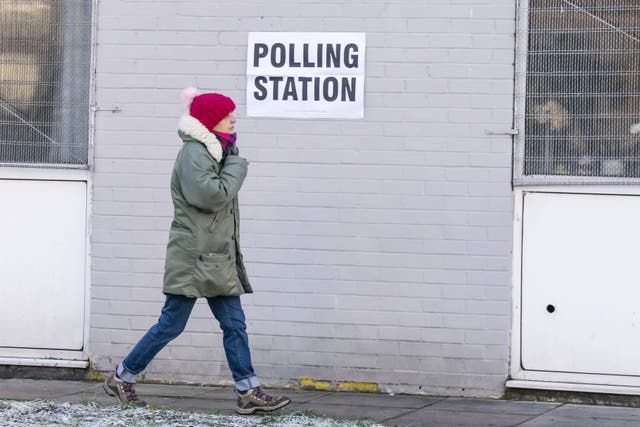 A woman arrives at Sharon Youth Centre in Stretford to vote (Danny Lawson/PA)