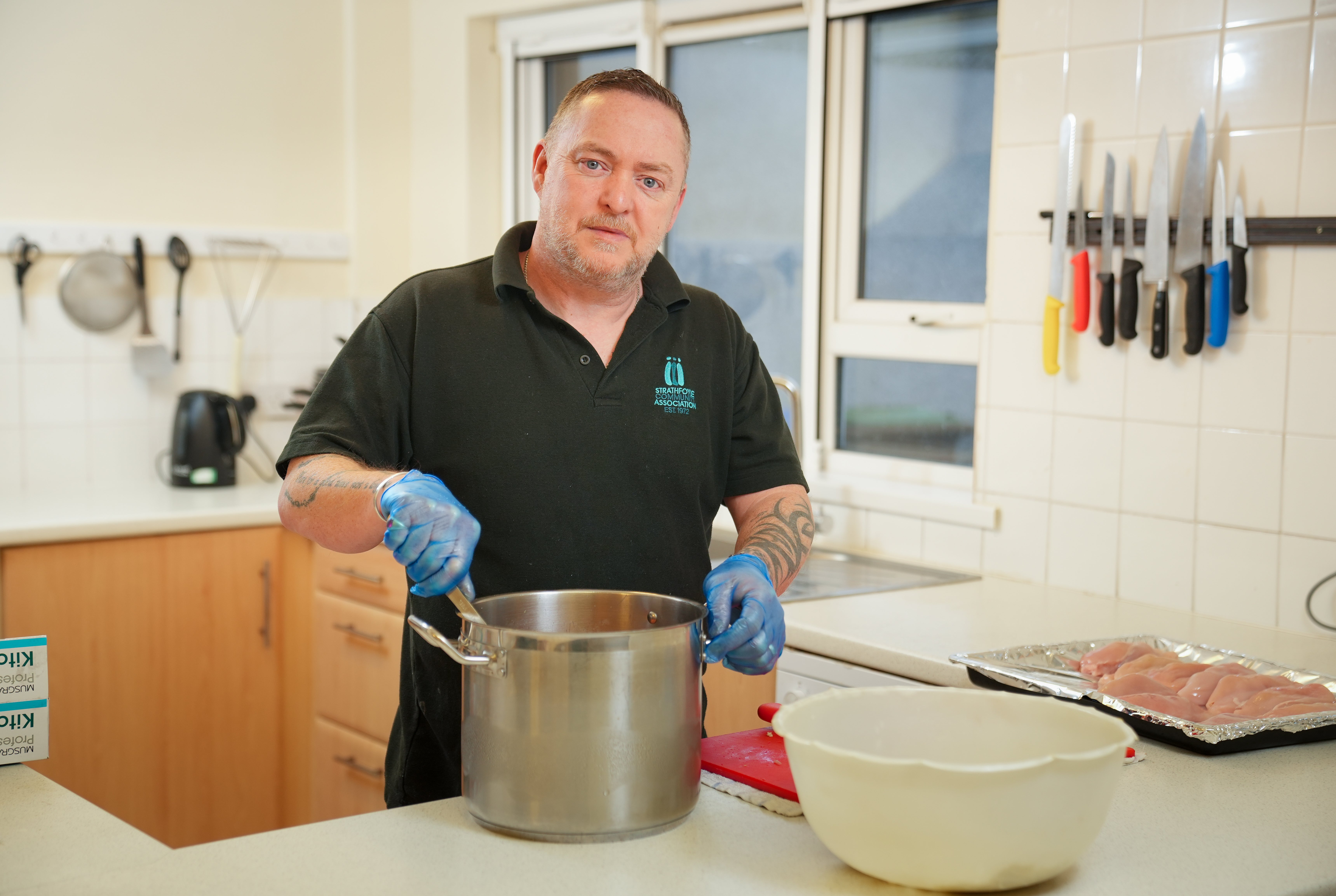 Project worker and chef Jeff Simpson preparing meals