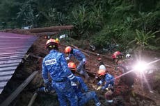 At least 12 killed and dozens feared trapped as Malaysia landslide sweeps through campsite