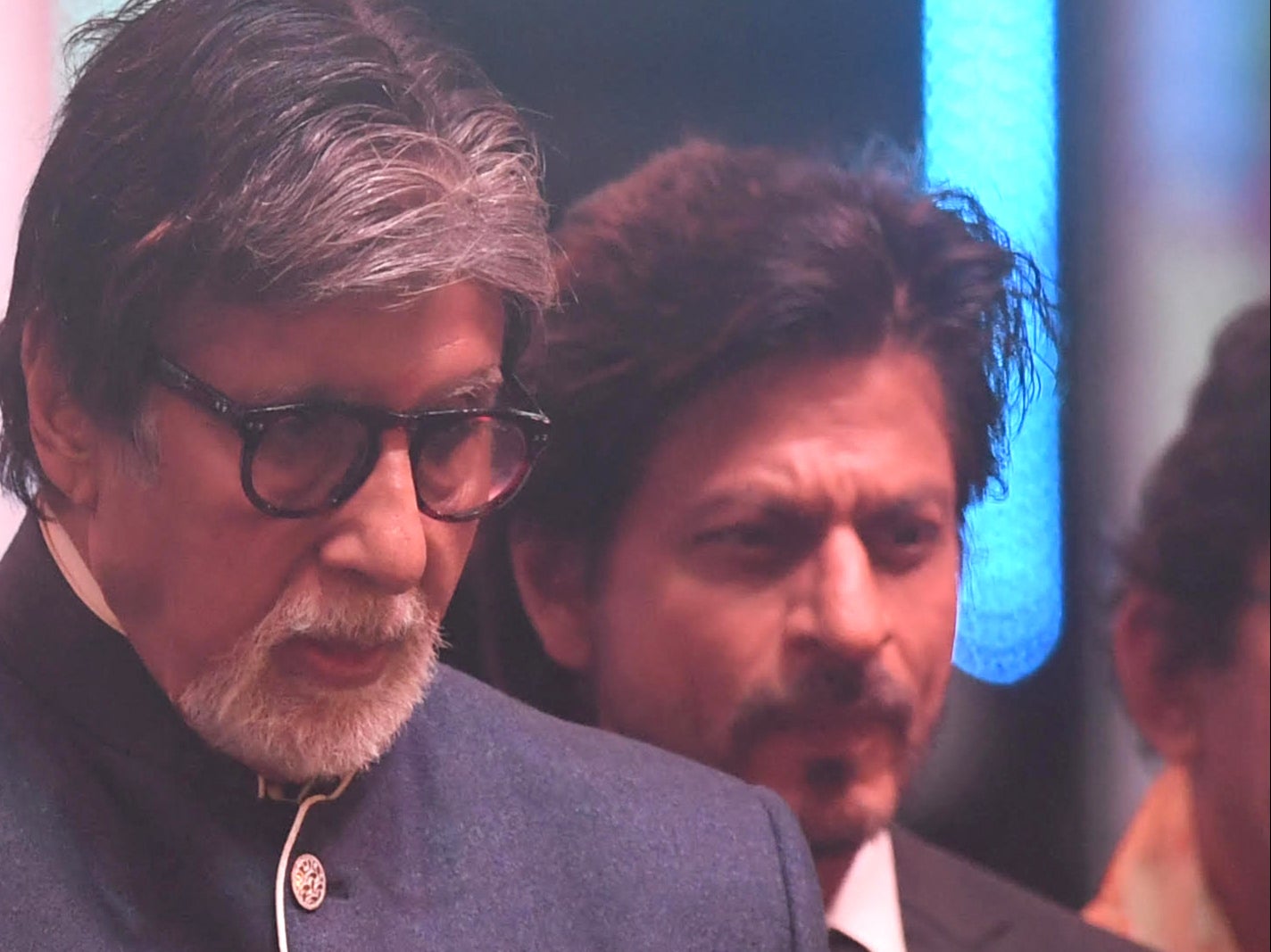 Bollywood actor Shah Rukh Khan (R) with actor Amitabh Bachchan