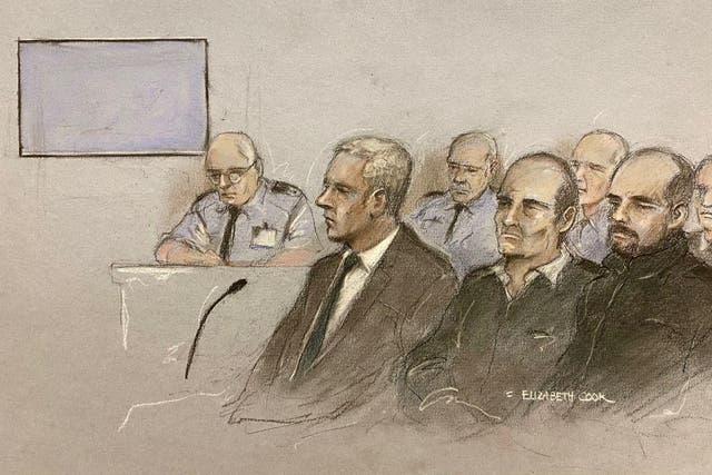 Court artist sketch by Elizabeth Cook of Jonathan Dowdall (front left), surrounded by dock officers and police during the trial at the Special Criminal Court, Dublin, of Gerry “The Monk” Hutch (third left) for the murder of David Byrne at a hotel in Dublin in 2016. Mr Byrne, 34, was killed during a crowded boxing weigh-in at the Regency Hotel in one of the early attacks of the Hutch-Kinahan gangland feud. Issue date: Monday December 12, 2022.