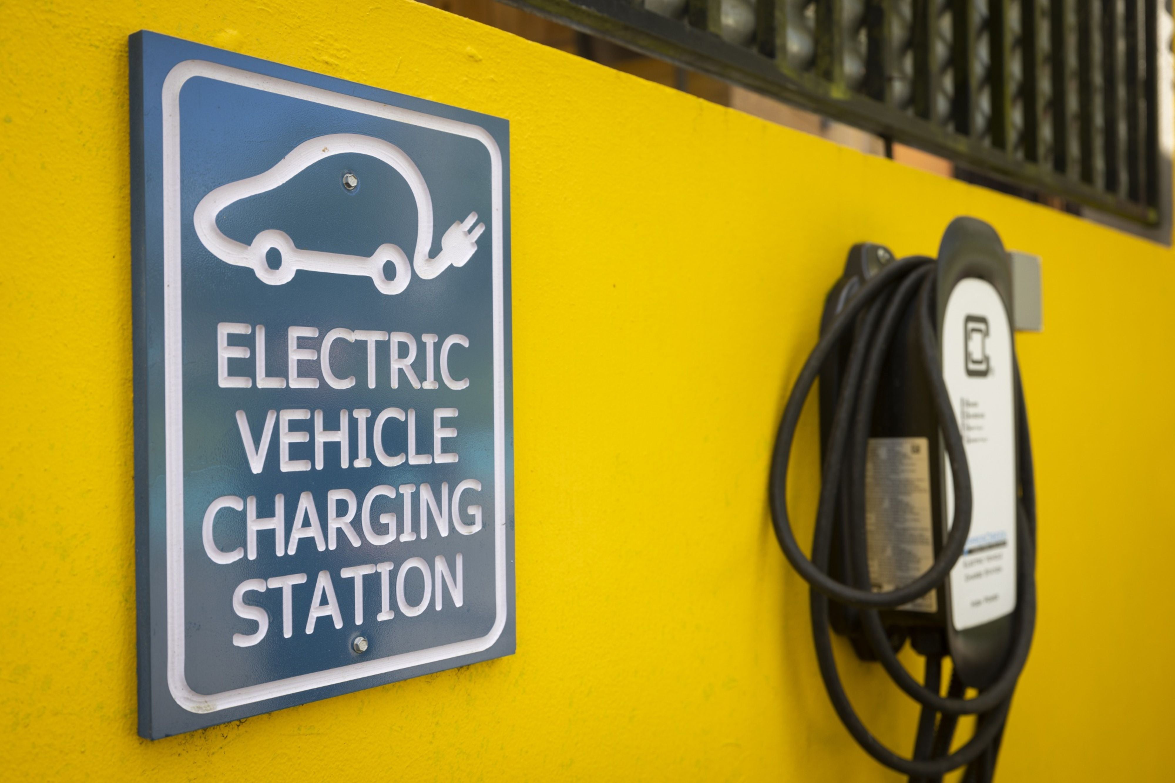 An EV charger is connected to the microgrid