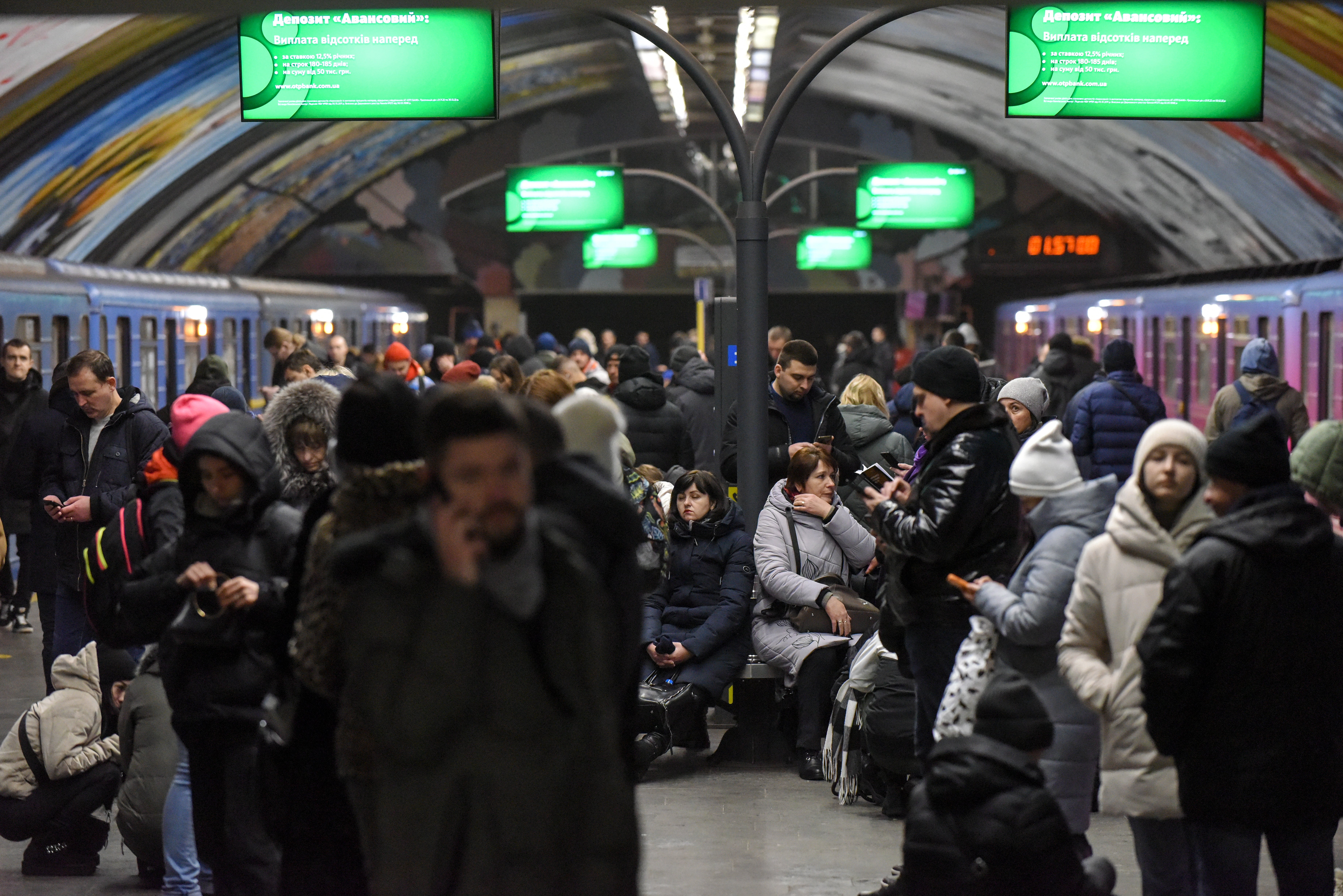 Civilians take refuge in a Kyiv underground station on Friday