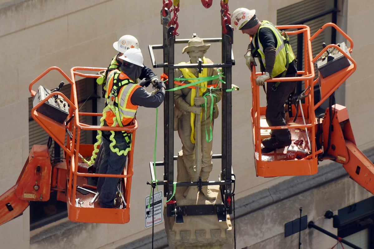 Statue Hoisting NC Supreme Court dismisses suit to return Confederate statue | The ...